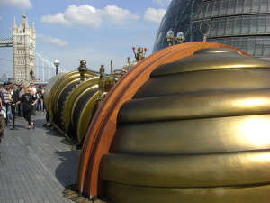 "Telectroscope aperture at London City Hall showing Tower Bridge and Canary Wharf" by Original uploader was Colonel Warden at en.wikipedia - Transferred from en.wikipedia; transferred to Commons by User:Undead_warrior using CommonsHelper.. Licensed under CC BY-SA 3.0 via Wikimedia Commons - http://commons.wikimedia.org/wiki/File:Telectroscope_aperture_at_London_City_Hall_showing_Tower_Bridge_and_Canary_Wharf.jpg#mediaviewer/File:Telectroscope_aperture_at_London_City_Hall_showing_Tower_Bridge_and_Canary_Wharf.jpg